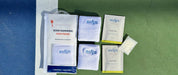 The Swips 2-pack laid out on a pickleball court: retail pouch, two sweatbands, two foil sachets and a rosin insert