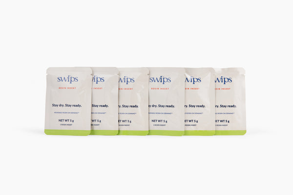 Six sealed Swips rosin insert sachets in a row, the Rosin Insert Refills 6-Pack
